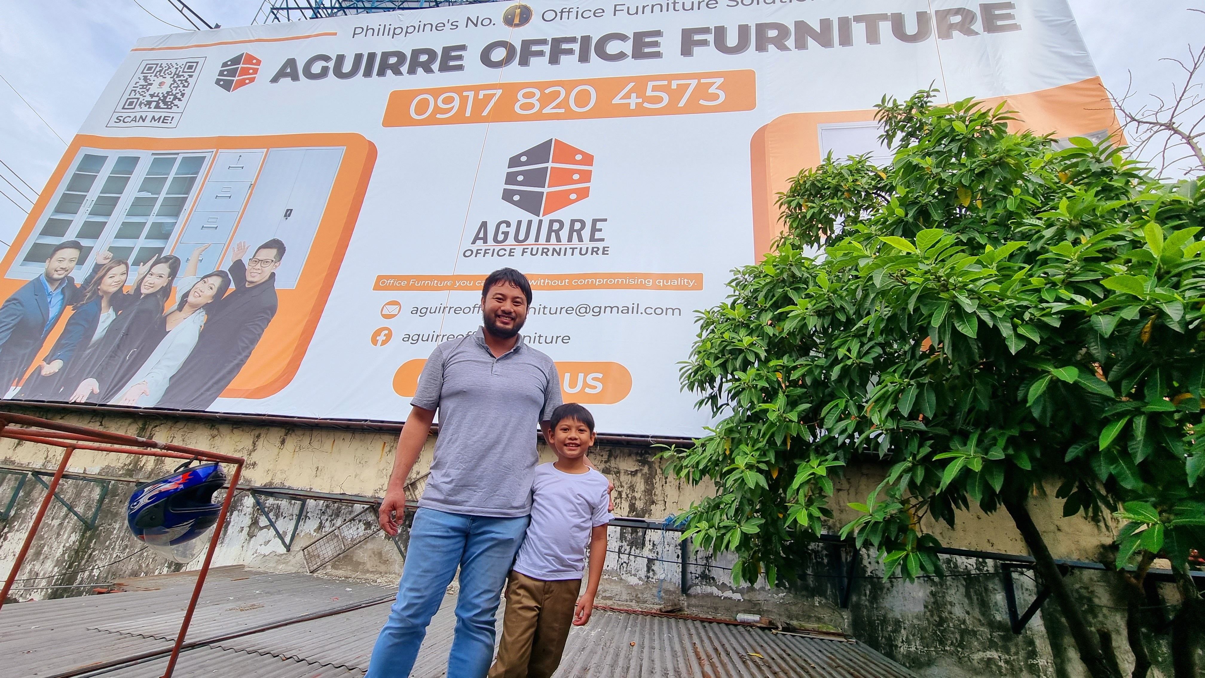 man-standing-with-son-by-billboard