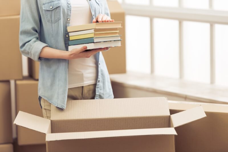 Lady-Packing-Books-into-Box