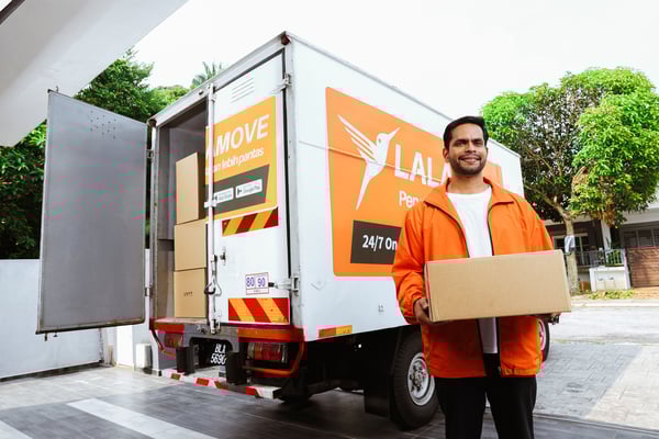 Lalamove driver carrying a box