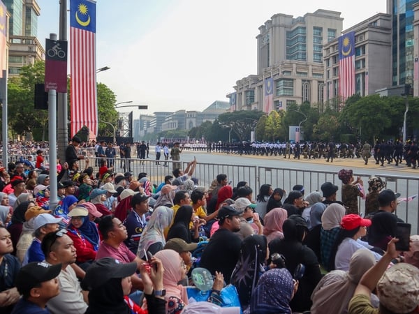 arrive early at the Merdeka parade