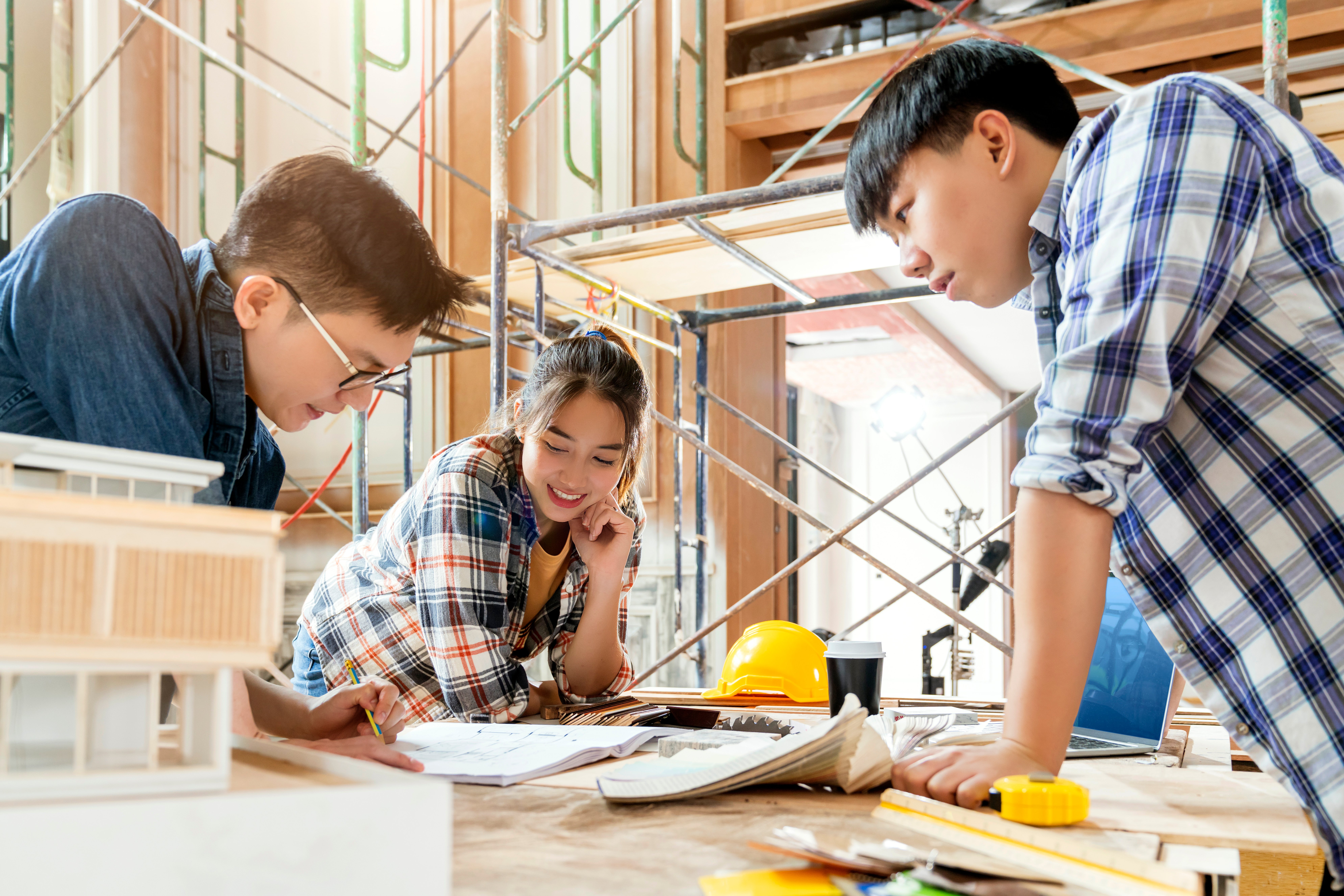 group-smart-asian-architect-interior-design-team-consulting-with-constrction-engineer-work-brainstrom-meeting-with-house-project-blueprint-home-mockup-house-renovation-structure-background