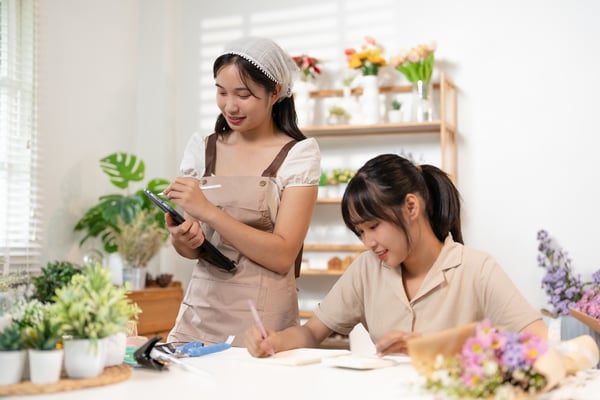 two girls doing online business