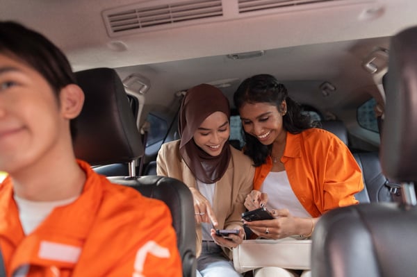 two girls sitting inside lalamove ride car