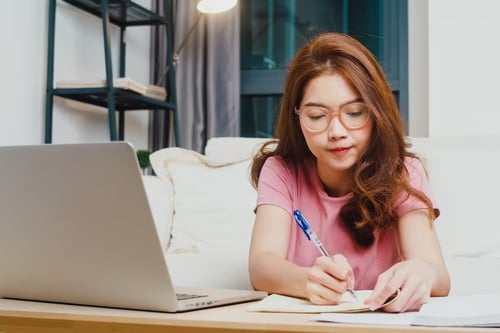 woman writing laptop planning bisnis business