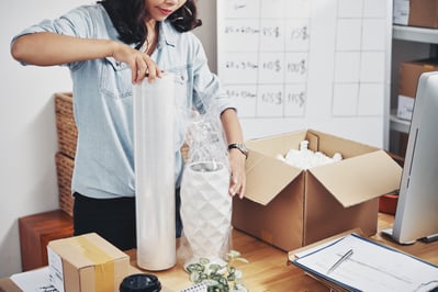 woman-packing-order-box