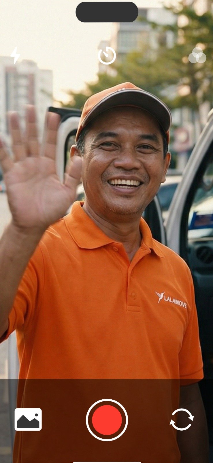 driver lalamove smiling waving at the camera recording himself for lalamove my contest