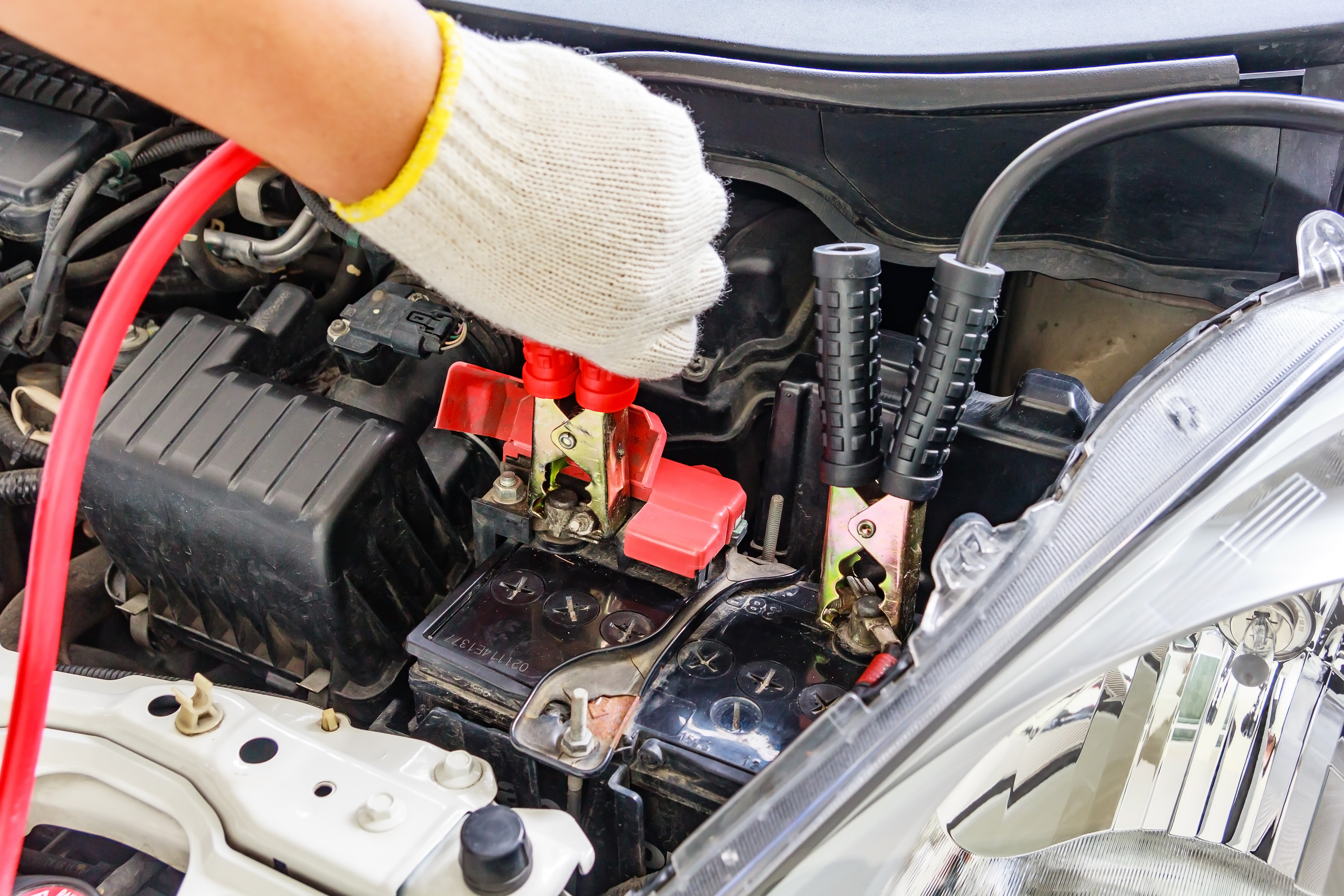 vecteezy_charging-car-battery-with-electricity-trough-jumper-cables_3016563